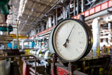 Industrial view at the thermal power station. Electricity generator. Hot water supply. Pipes and...