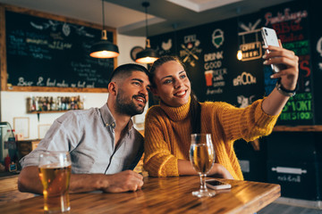 friends taking selfie picture in food corner bar