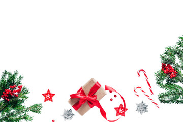 Christmas and New Year card with fir branches, gift boxes and decor on the white background. Copy space. Top view.