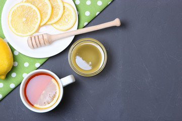 tea, honey and lemon on the table top view.