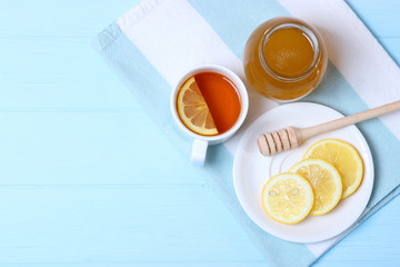 tea, honey and lemon on the table top view.