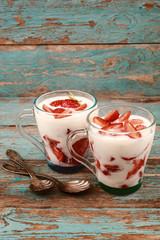 Fresh strawberries with sour cream in a bowl