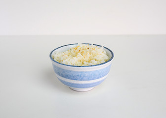 Japanese ripe rice with sesame in ceramic cup