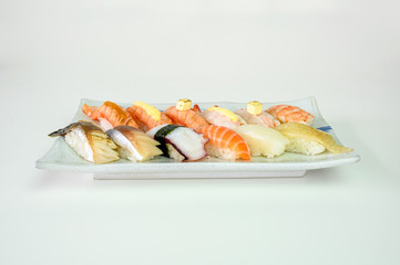Japanese sushi nigiri of Salmon, Shrimp, Saba, Tako, Squid, Engawa on ceramic plate