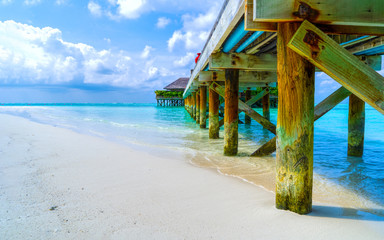 Wooden bridges leading to the huts on the shores of the tropical