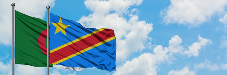 Algeria and Congo flag waving in the wind against white cloudy blue sky together. Diplomacy concept, international relations.