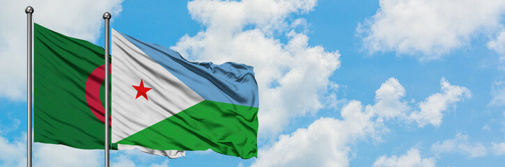 Algeria and Djibouti flag waving in the wind against white cloudy blue sky together. Diplomacy concept, international relations.