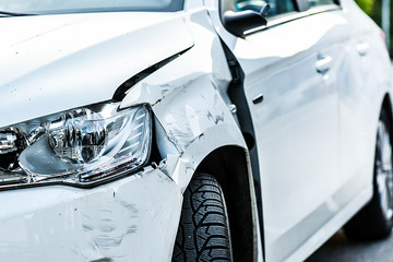 Car crash or accident. Front fender and light damage and scratchs on bumper. Broken vehicle detail...