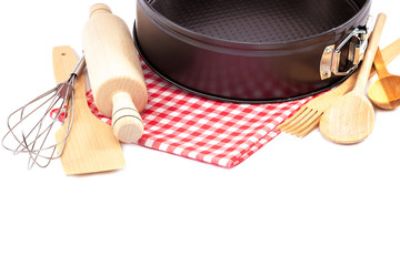Baking dish and supplies isolated on a white background
