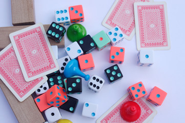 collection of board game movers, dice and cards from top