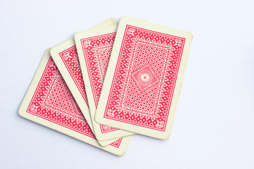 hand of four red playing cards