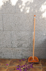 Broom with lots of autumn leaves