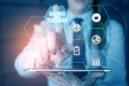 Writing note showing Giving Tuesday. Business concept for international day of charitable giving Hashtag activism Woman wear formal work suit present using smart latest device