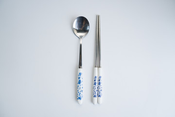 Set of chinese traditional cutlery spoon fork chopstick teaspoon with blue texture patern isolated...