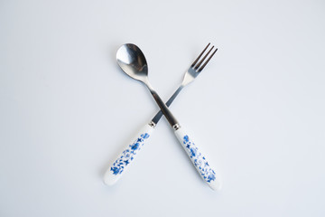 Set of chinese traditional cutlery spoon fork chopstick teaspoon with blue texture patern isolated on white background