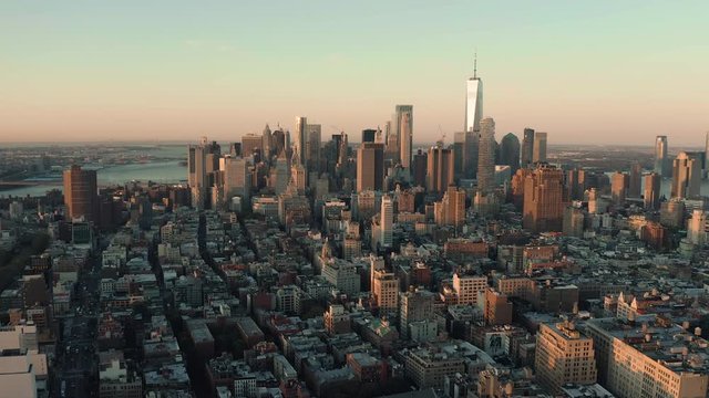 Aerial panorama of Lower Manhattan business district at sunrise, skyline of New York with amazing morning light