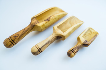 Traditional wood object wooden scoop or spoon isolated on a white background from various angle and...