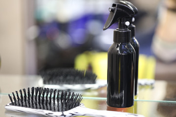 hair brush and spray gun on a table in a hairdresser