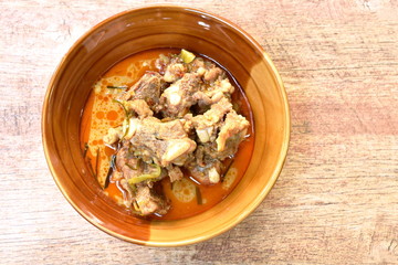 boiled pork bone with coconut milk curry on bowl