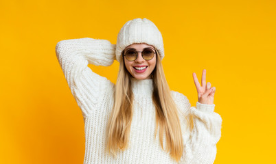 Portrait of attractive girl in white knitted winter set