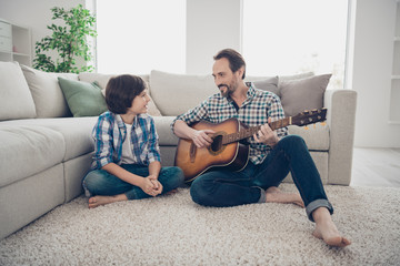 Spending time with closest person concept. Cheerful positive kind father singing song to his lovely...