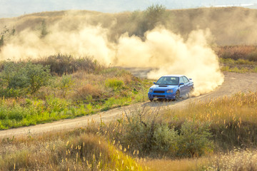 Obraz na płótnie Canvas Sports Car on a Bend and a lot of Dust 02