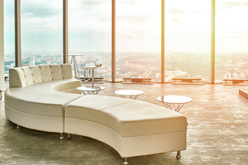 Abstract business interior with a glass wall and panoramic views of the beautiful city ponama. Metal chairs and tables. City life concept.