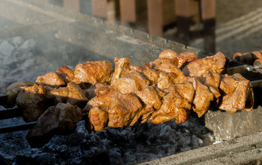 cooking meat on the grill, cooking on the coals
