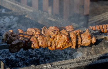 cooking meat on the grill, cooking on the coals