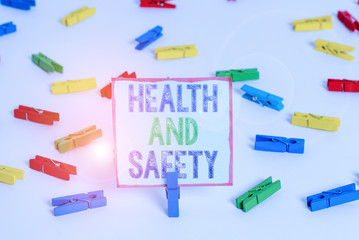 Word writing text Health And Safety. Business photo showcasing procedures intended to prevent accident in workplace Colored clothespin papers empty reminder white floor background office