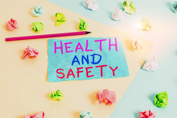 Conceptual hand writing showing Health And Safety. Concept meaning procedures intended to prevent accident in workplace Colored crumpled paper empty reminder blue yellow clothespin