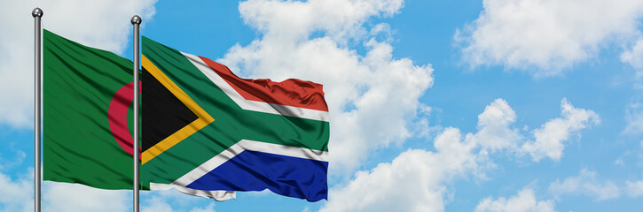 Algeria and South Africa flag waving in the wind against white cloudy blue sky together. Diplomacy concept, international relations.