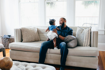 Father and daughter playing together