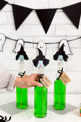 Woman want to drink Halloween creative green cocktail