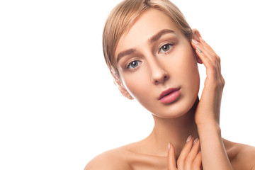 Fototapeta premium Beautiful blonde hair girl with clean nude makeup isolated white background. Skin care concept