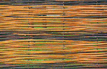 twigs fence with metal structure