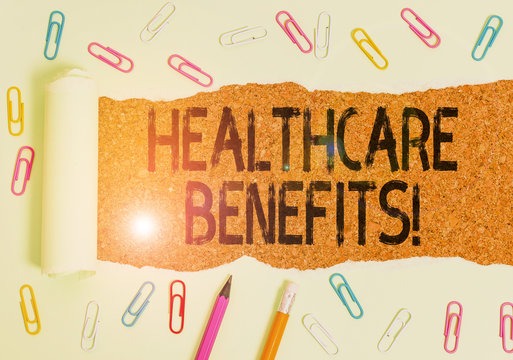 Text sign showing Healthcare Benefits. Business photo showcasing monthly fair market valueprovided to Employee dependents Stationary and torn cardboard placed above a wooden classic table backdrop