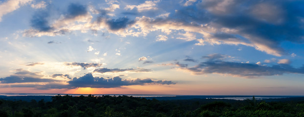 Obraz premium Sunlight with dramatic sky. sunset on dark background.Vivid orange cloud sky.
