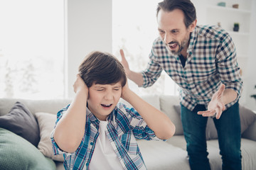 Portrait of two guys evil frustrated fury dad and depressed pre-teen son in casual checked shirt...