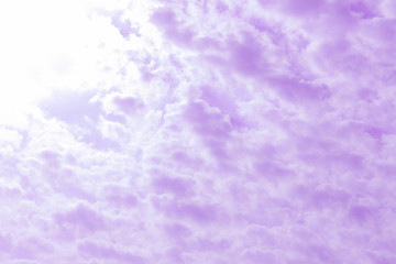 white clouds in a pink sky