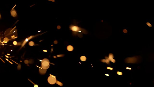 Super slow motion of burning sparklers on black background. Filmed on high speed cinema camera, 1000fps.