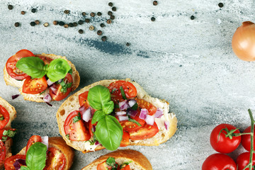 fresh tomato bruschetta. italian food appetizer with basil on table