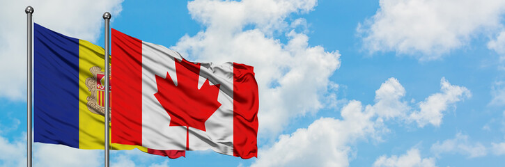 Andorra and Canada flag waving in the wind against white cloudy blue sky together. Diplomacy concept, international relations.