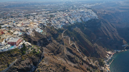 Aerial drone photo of famous church of Agios Nikolaos in Firostefani area with beautiful view to Caldera, Santorini island, Cyclades, Greece