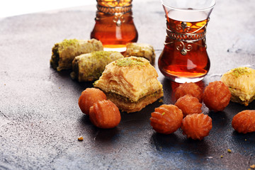 Baklava on table. Middle eastern or arabic dishes. Turkish Dessert Baklava with pistachio on rustic...