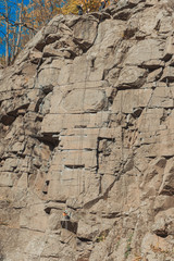 Rocks for climbing rope in natural conditions on a natural relief along prepared routes. Space for text.