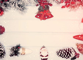christmas background with decorations and snow on wooden board