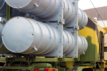 Launcher. The symbol of war. Anti-aircraft missiles on a background of trees. Military missiles.