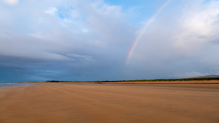 Rainbow over Brora beach in the Highlands of Scotland