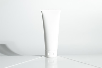 fresh beauty spa medical skincare and cosmetic lotion cream facial tube bottle packaging product on white decor background with summer season sun light